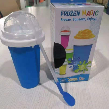 Blue ice cream maker cup with packaging labeled 'Frozen Magic' on a light surface.