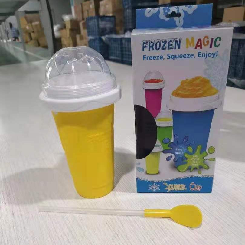Yellow Slushy Maker Cup with packaging on a light surface