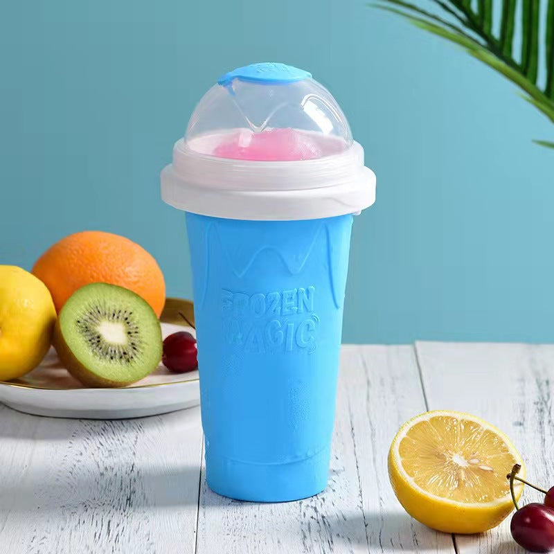 Blue ice cream freezer with pink ice cream on a wooden surface with fruits in the background