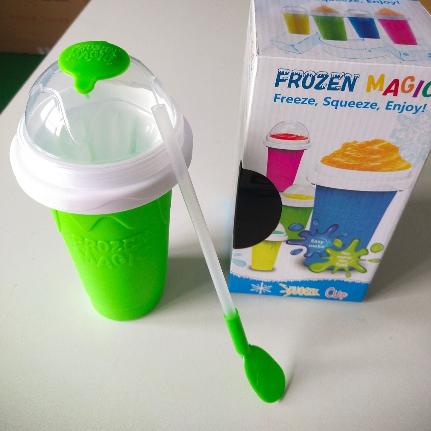 Green and white Slushy Maker Cup with packaging in the background