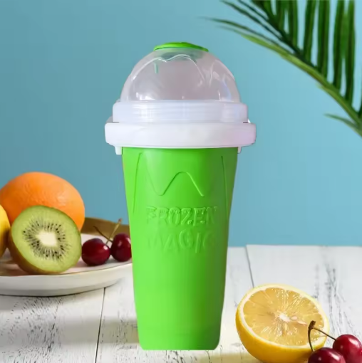 Green Frozen Magic ice cream maker with fruits on a table
