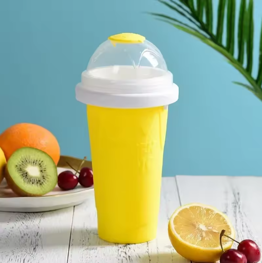 Yellow ice cream mold with a white lid on a table with fruits